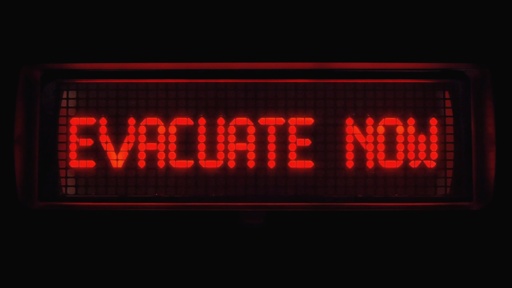 Image,Of,A,Digital,Sign,That,Says,Evacuate,Now Red digital sign displaying 'EVACUATE NOW'