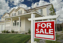 Wall Street Banned From Buying Homes House with For Sale sign in front yard.