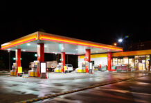 THESE STATES Use GAS TAX Price Creep — No Vote Needed — Do You Live in ONE of THESE? A gas station illuminated at night with fuel pumps and a convenience store