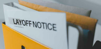 Folder with layoff notice in yellow box.