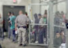 Mexico vs. ICE: Courtroom Showdown Looms People detained behind fencing in a detention center.