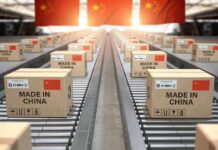 China’s Blacklist Slams EU Defense Titans Cardboard boxes on a conveyor belt in a warehouse