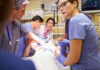 Brain Worm Horror Stuns Doctors Medical team working on patient in hospital emergency room.