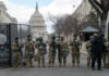 Courts Eye Trump’s DC Military Play Armed soldiers standing guard outside the Capitol building