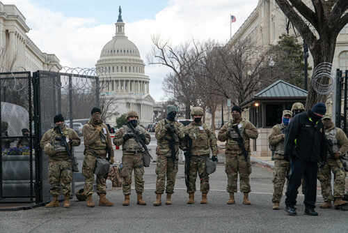 Washington,,D.c.,-,January,20,,2021:,National,Guard,Troops,And Armed soldiers standing guard outside the Capitol building