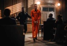 Pardoned Child Rapist Ignites National Brawl Inmate in orange jumpsuit escorted by officer in courtroom