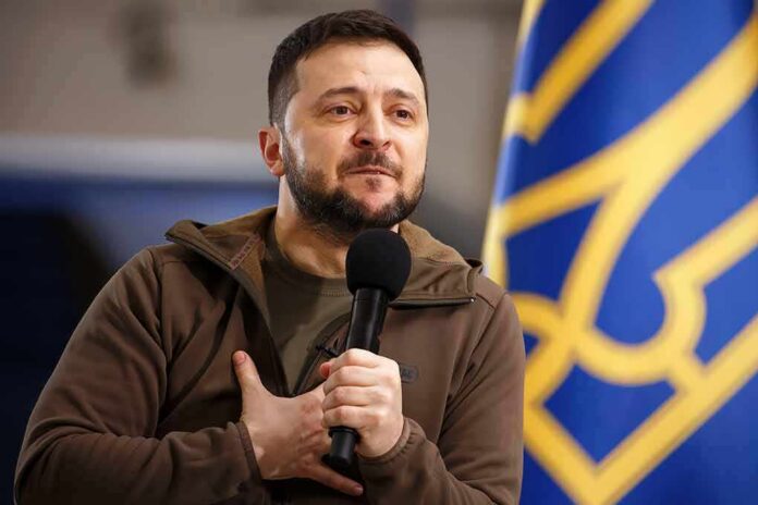 man holding a microphone with hand on chest