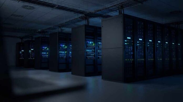 Rows,Of,Modern,Server,Racks,Displaying,Active,Blue,And,Green Rows of illuminated server racks in a dark data center