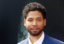 Jussie Smollett posing at a red carpet event