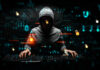 Hacker in hoodie surrounded by digital symbols and locks.