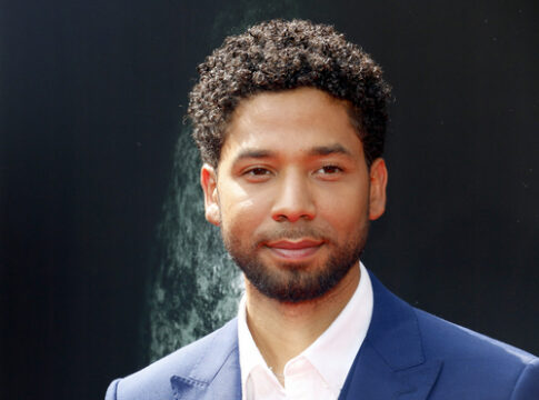Jussie Smollett posing at a red carpet event